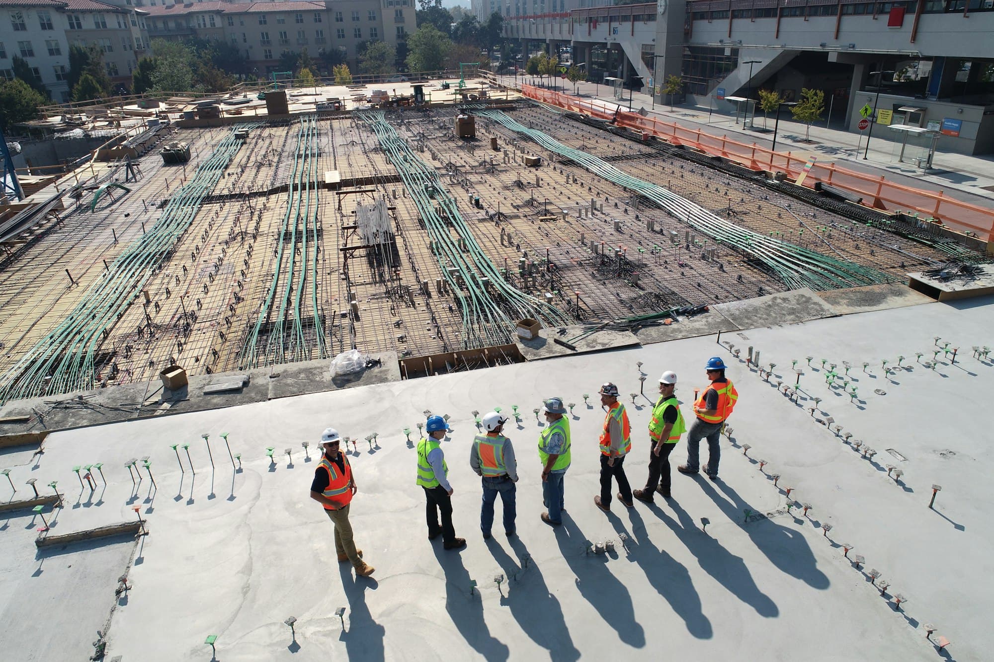 Engineers walking across a large construction site