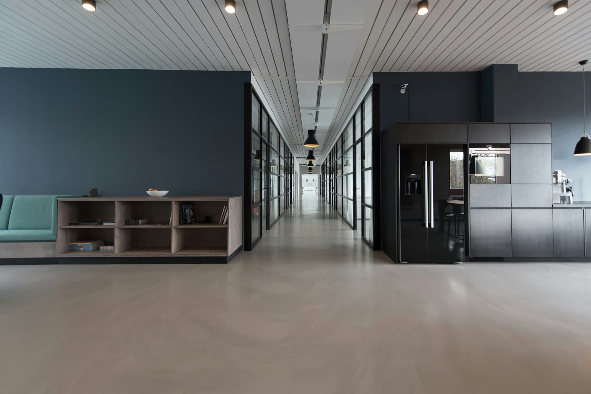 A quiet, modern office corridor